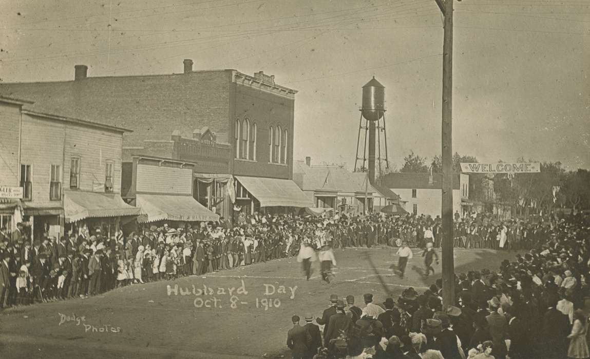 Cities and Towns, storefront, Cook, Mavis, Fairs and Festivals, game, Hubbard, IA, veranda, sign, Iowa History, Iowa, water tower, crowd, history of Iowa, Main Streets & Town Squares