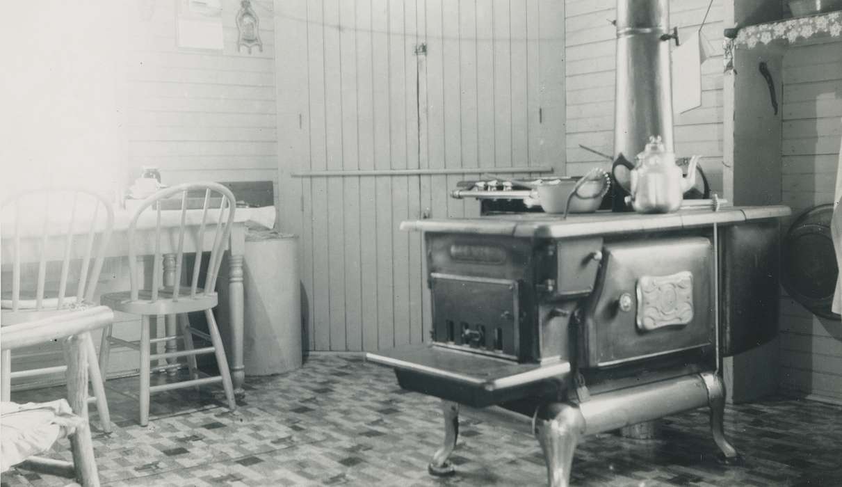wooden chair, Homes, coffee pot, kitchen, correct date needed, dining table, Waverly Public Library, Iowa History, Waverly, IA, stove, Iowa, wood stove, history of Iowa