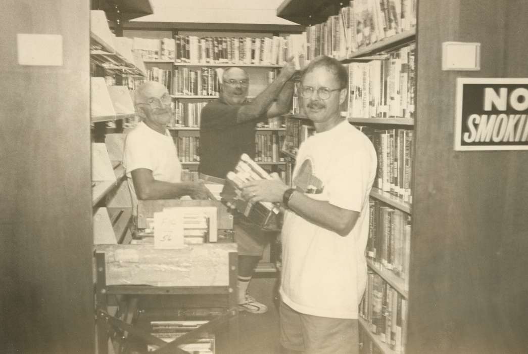 books, men, bookshelf, Waverly Public Library, Civic Engagement, Iowa History, Portraits - Group, library, Iowa, history of Iowa, volunteer