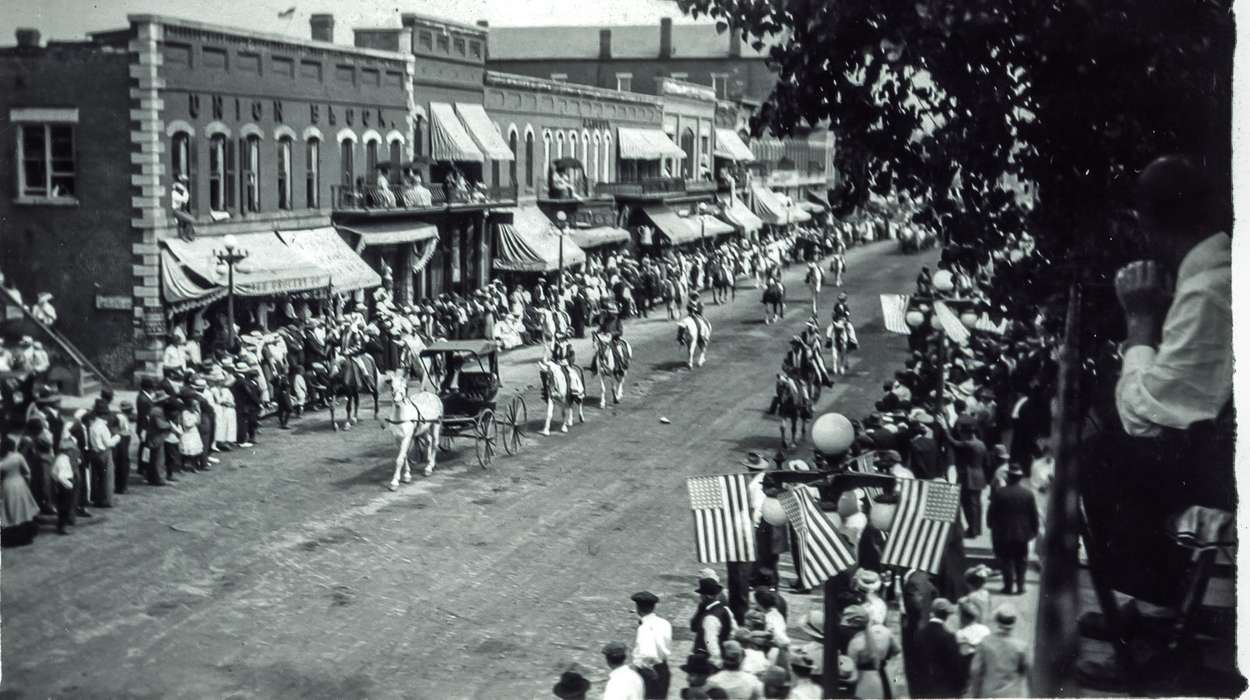 horse, Anamosa, IA, Entertainment, Main Streets & Town Squares, Iowa History, Iowa, road, Fairs and Festivals, storefront, crowd, Cities and Towns, flag, Anamosa Library & Learning Center, parade, history of Iowa, Animals, american flag