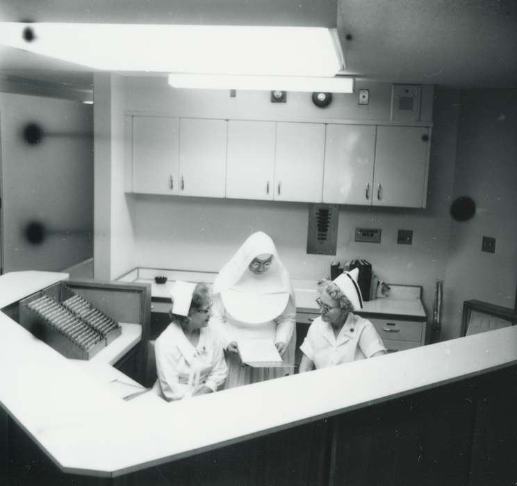 main street, Hospitals, desk, cupboard, Main Streets & Town Squares, Iowa, Iowa History, nurse, fluorescent light fixture, nun, glasses, Labor and Occupations, Waverly Public Library, history of Iowa