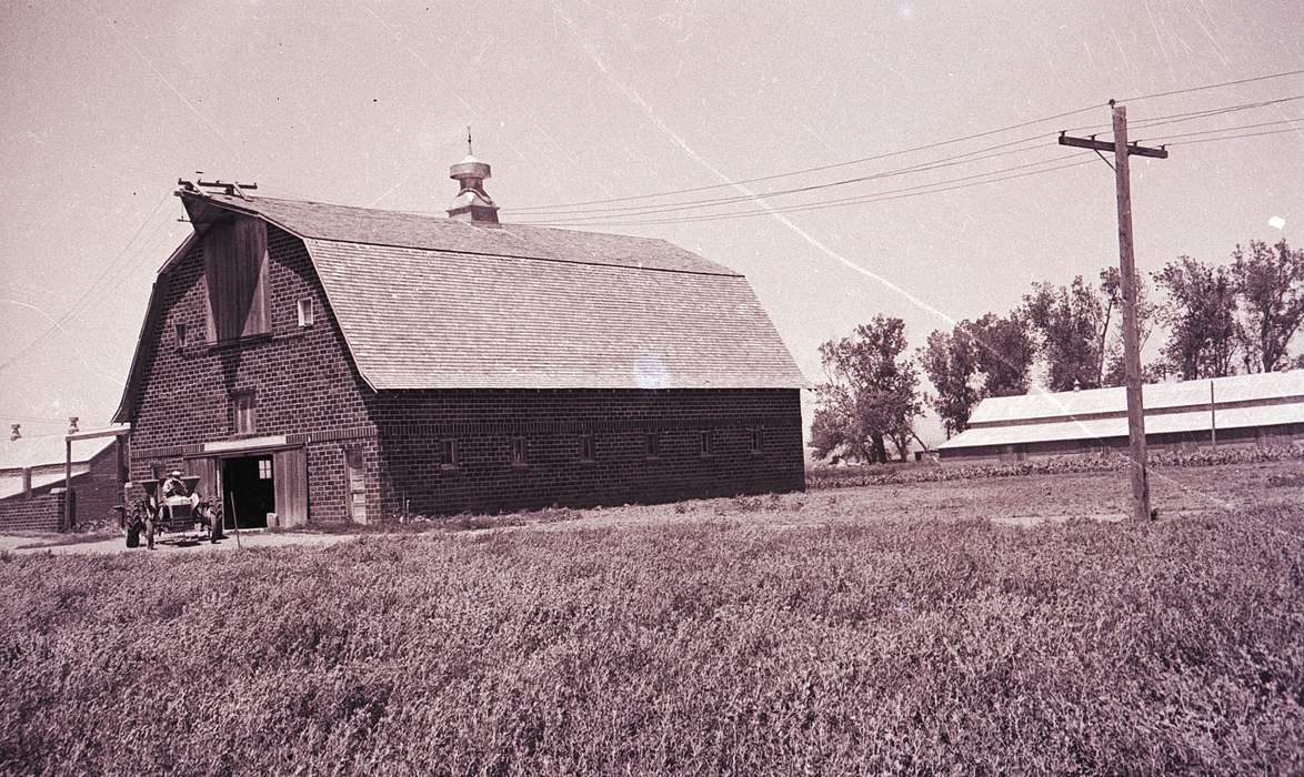 Barns, Iowa, Iowa History, history of Iowa, Motorized Vehicles, power line, Farms, brick barn, roof, tractor, Orange City, IA, Lyon, Howard