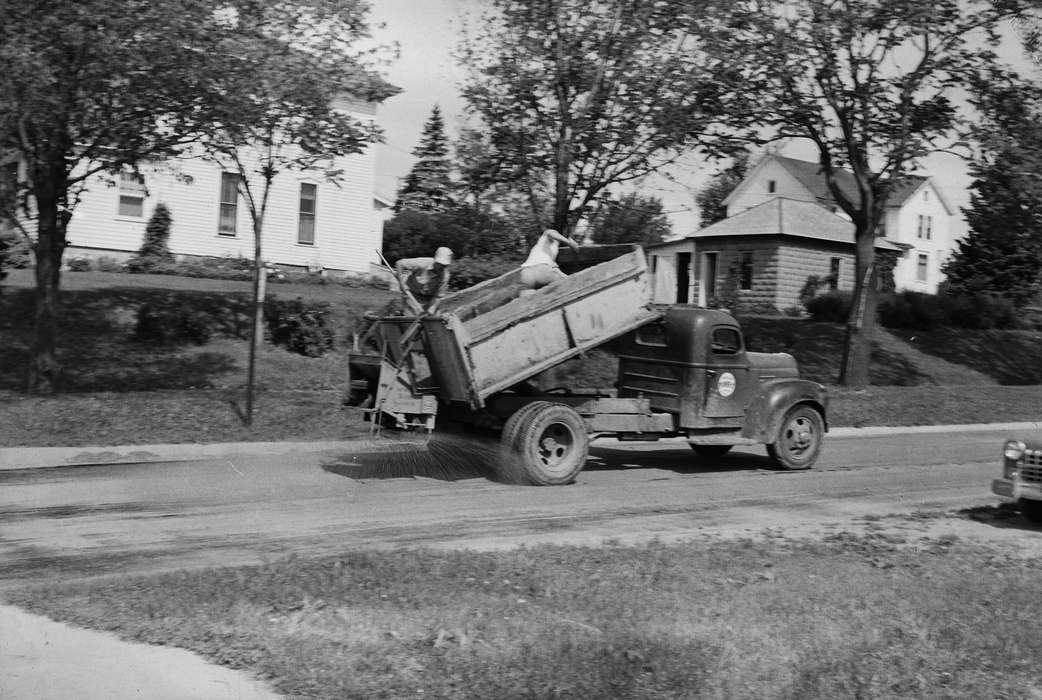IA, Cities and Towns, spray, historic, Motorized Vehicles, Coon Rapids, street, neighborhood, Iowa, United States, Photos, Labor and Occupations, two men, dump truck, shoveling, history, ia, Coon Rapids Enterprise