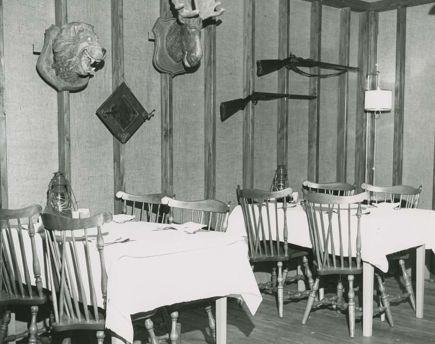 rifle, Food and Meals, Iowa, taxidermy, restaurant, Campopiano Von Klimo, Melinda, chair, tablecloth, Iowa History, history of Iowa, Des Moines, IA, dining table, Businesses and Factories, Cities and Towns, italian american