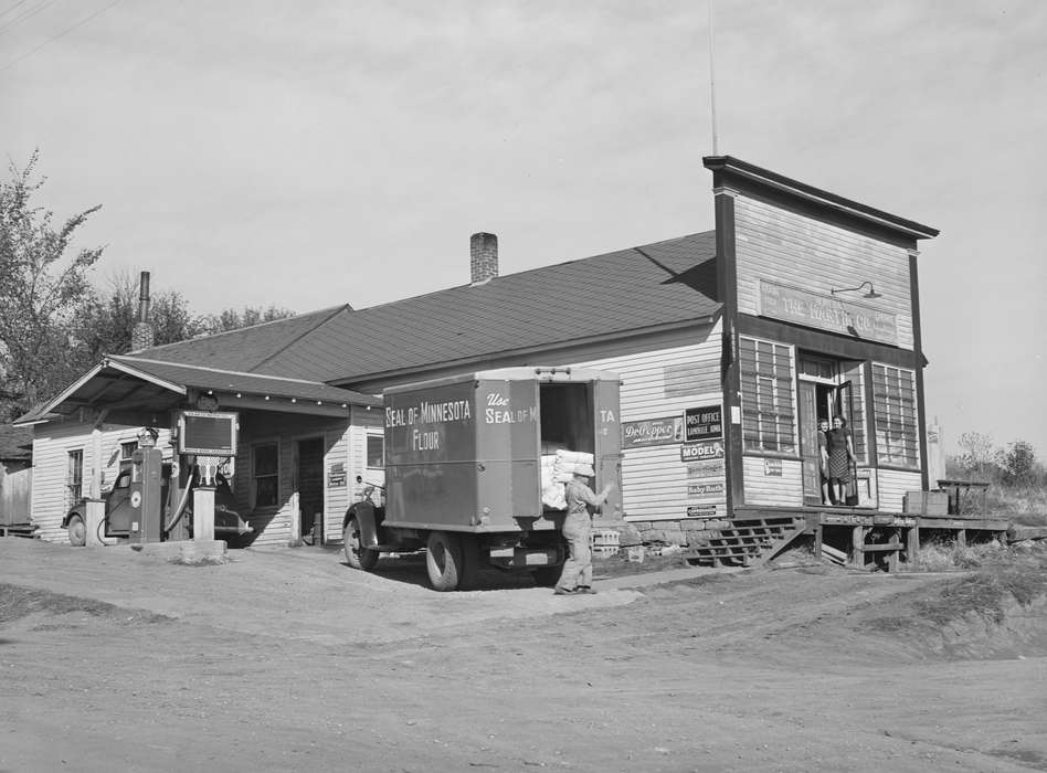 young women, Businesses and Factories, Iowa History, Labor and Occupations, Motorized Vehicles, Cities and Towns, history of Iowa, gas station, Main Streets & Town Squares, Iowa, Library of Congress, delivery truck, general store