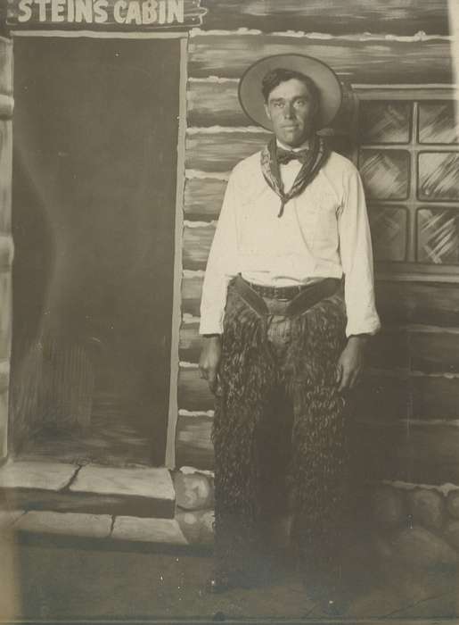 cowboy hat, handkerchief, chaps, bow tie, Portraits - Individual, cabin, cowboy, pose, USA, Iowa History, Iowa, Spilman, Jessie Cudworth, history of Iowa