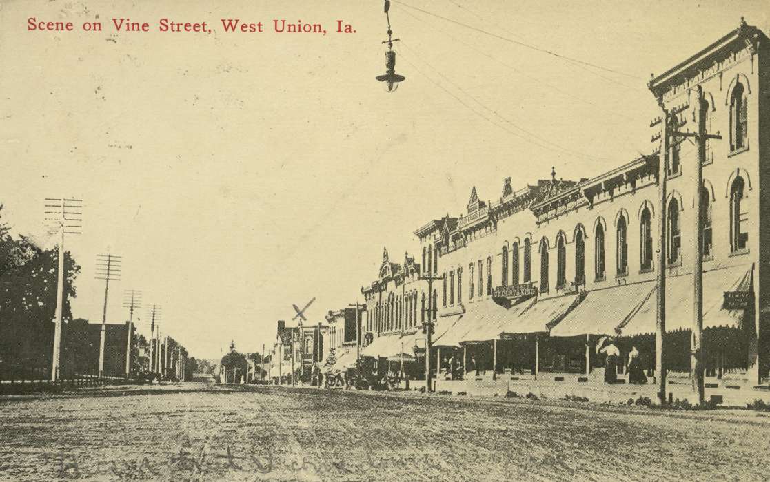 Baker, Earline, telephone pole, Cities and Towns, West Union, IA, Iowa History, storefront, Main Streets & Town Squares, mud, Iowa, road, store, history of Iowa