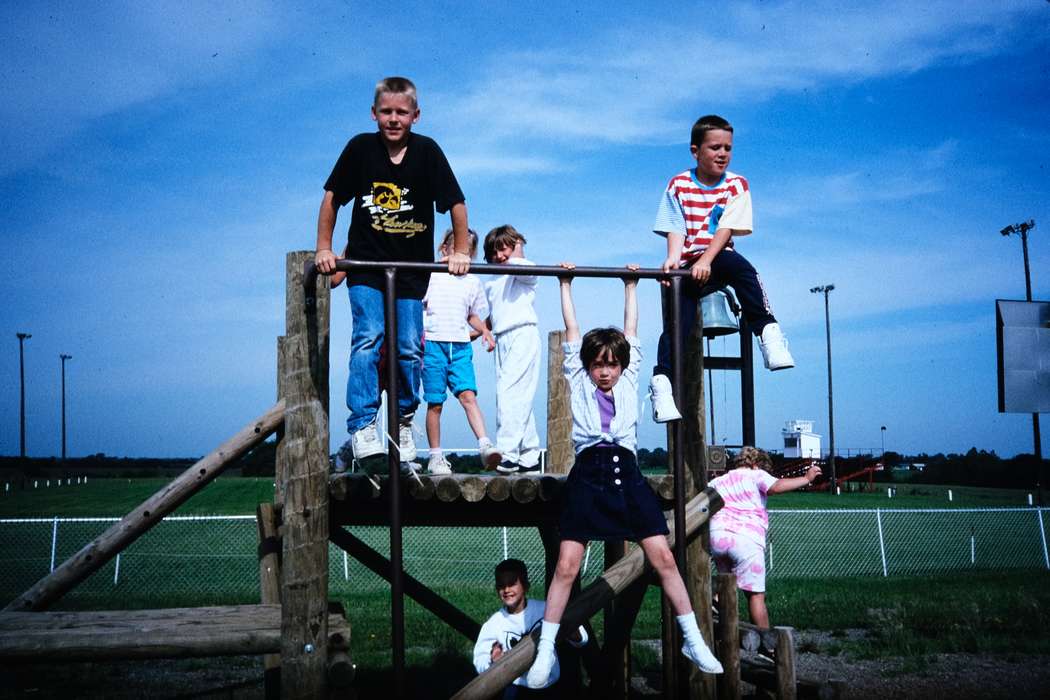 school trip, playground equipment, shorts, Children, chain link fence, Travel, history, Iowa, Coon Rapids Enterprise, boy, second grade missouri trip, playground, Portraits - Group, t-shirt, Photos, Leisure, ia, girl, United States, missouri trip, park, MO, historic