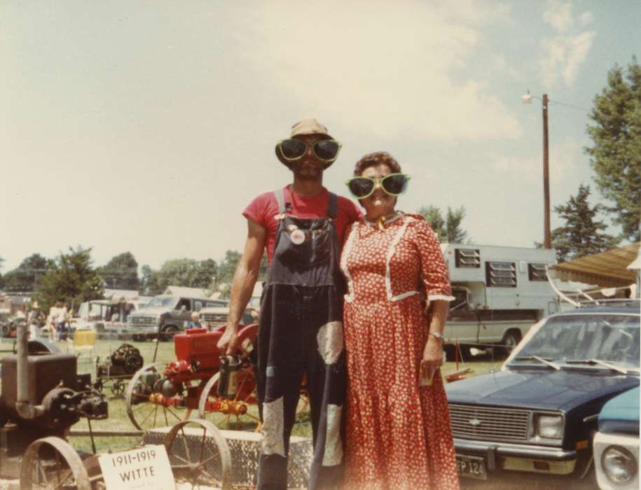 glasses, Fairs and Festivals, silly, woman, Farming Equipment, man, Iowa History, Belle Plaine, IA, Portraits - Group, Families, Iowa, overalls, dress, Motorized Vehicles, history of Iowa, Wiese, Rose