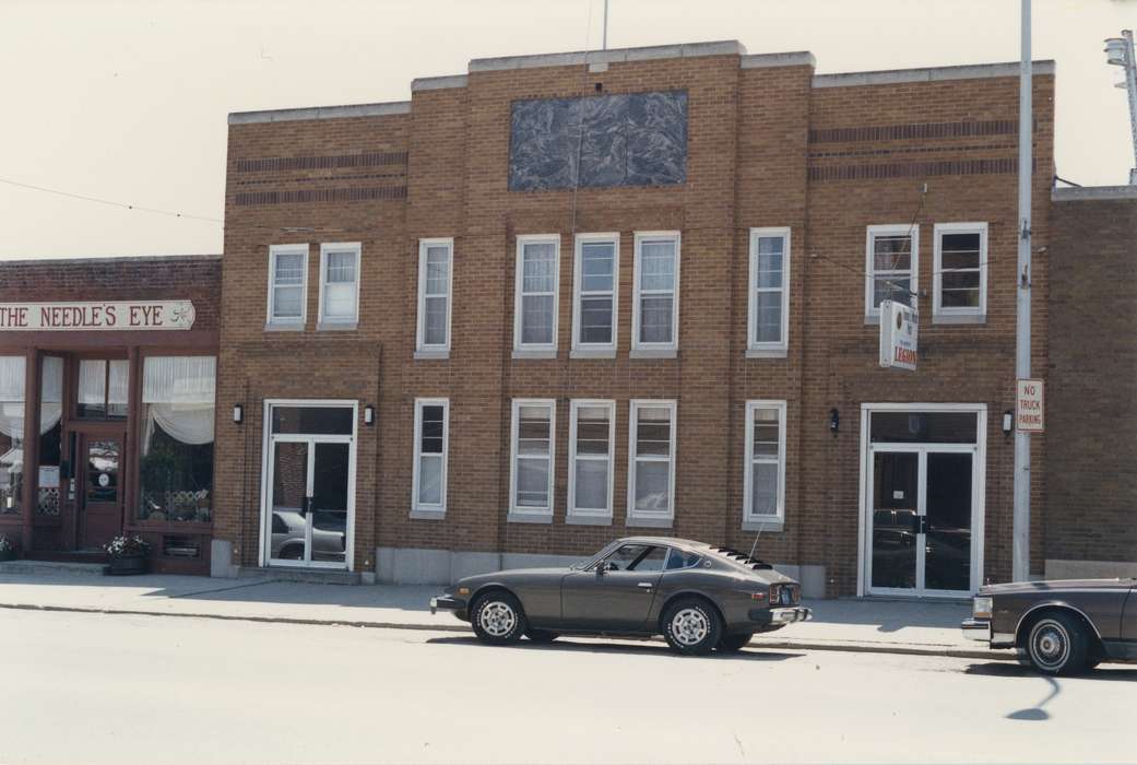 Businesses and Factories, storefront, Iowa History, sign, car, doorway, Iowa, Waverly Public Library, window, Main Streets & Town Squares, tires, Cities and Towns, history of Iowa, Motorized Vehicles