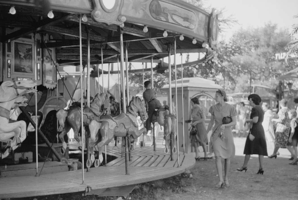 Families, Outdoor Recreation, Iowa, Fairs and Festivals, Main Streets & Town Squares, merry-go-round, fairground, carnival, history of Iowa, Entertainment, Children, Leisure, Library of Congress, Iowa History, carousel