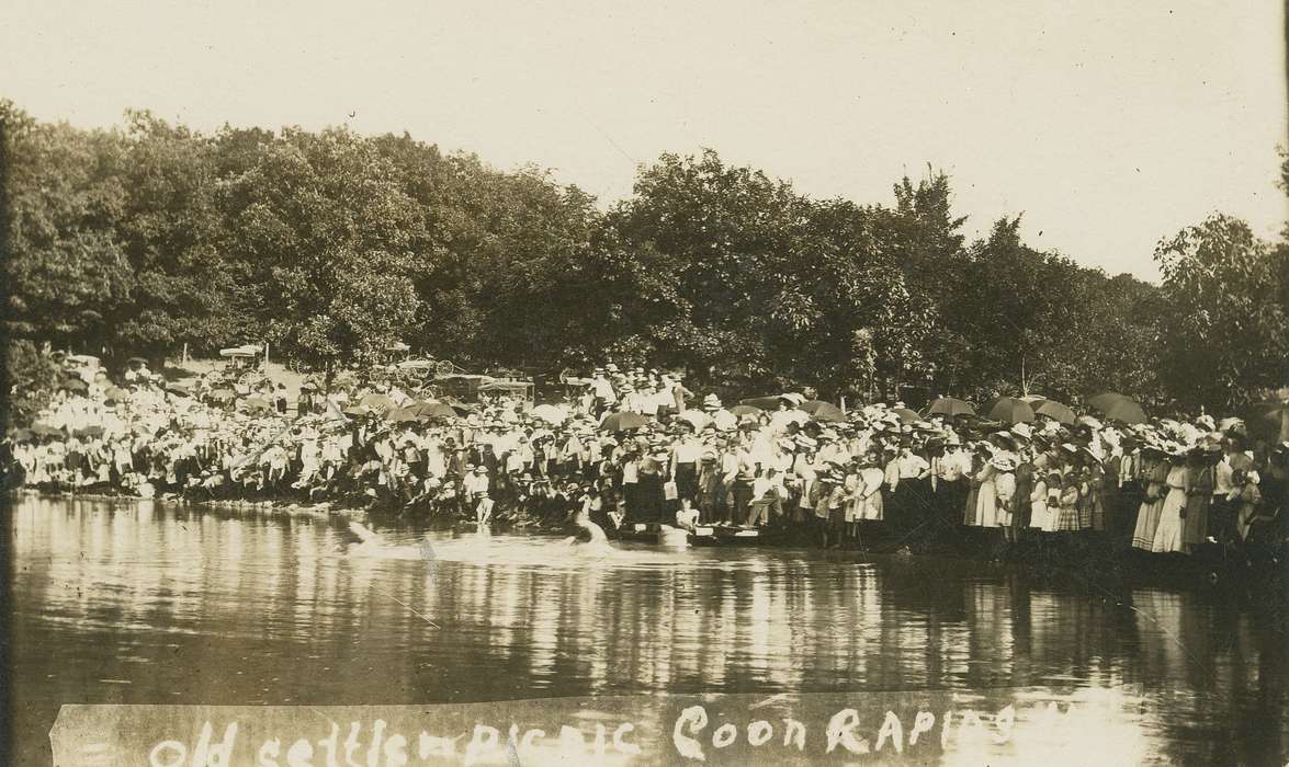 water, Entertainment, car, Cities and Towns, dress, Portraits - Group, Motorized Vehicles, Children, Lakes, Rivers, and Streams, Families, tree, Coon Rapids Enterprise, umbrella