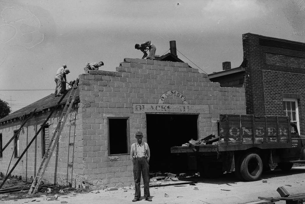 Businesses and Factories, history, Photos, Labor and Occupations, ladder, Iowa, IA, Portraits - Individual, brick building, old man, United States, ia, Coon Rapids Enterprise, historic, men at work, work truck, blacksmith, Coon Rapids