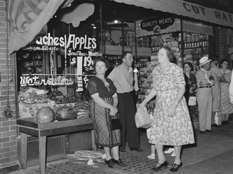 history of Iowa, general store, Iowa History, mainstreet, Businesses and Factories, Families, Main Streets & Town Squares, Cities and Towns, window display, storefront, Iowa, Food and Meals, Leisure, Library of Congress, mingling